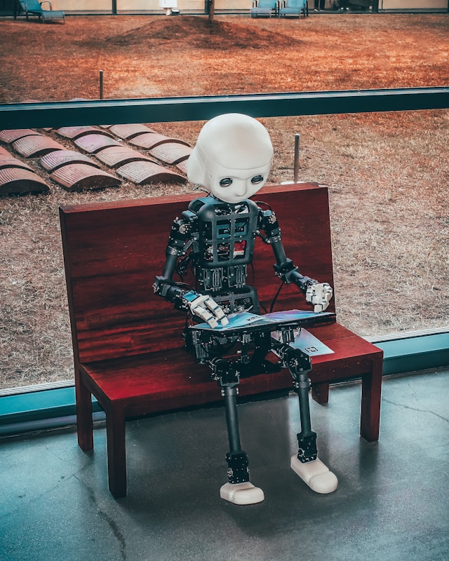 A robot holding a pad in hand showing the future of AI