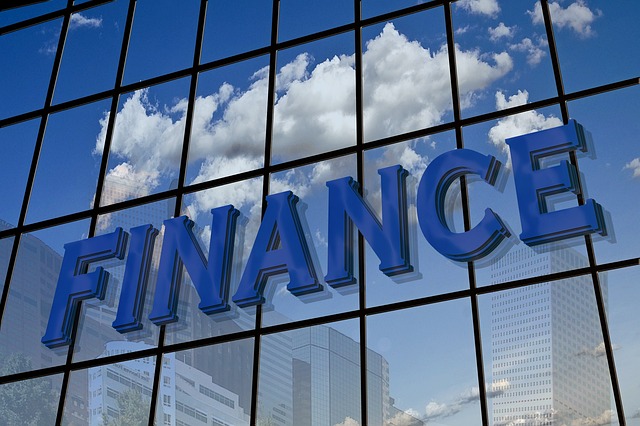 FINANCE written on a mirror building