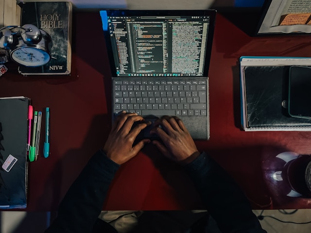 a person building an app with no code plateform on a laptop