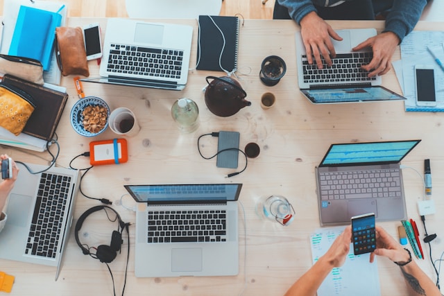 tech gadgets like laptop mobile and tablets on the table